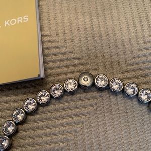 Michael Kors tennis necklace.. Bezel set precious stones. Magnetic closure.